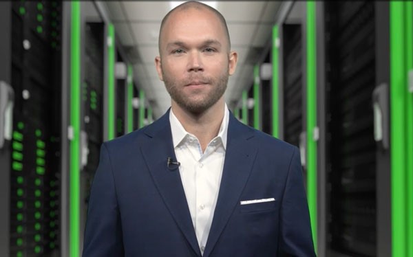 A person in a suit Description automatically generated